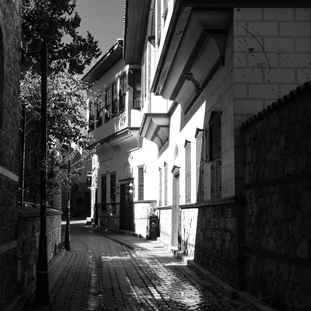 A quiet stone alley in the old city of Jerusalem at golden hour.